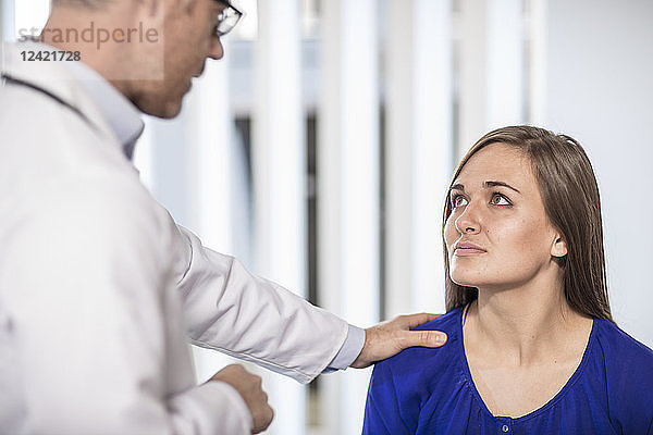 Doctor talking to patient in medical practice