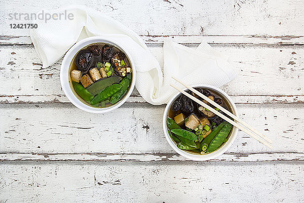 Japanese miso soup  sugar peas  shitake  tofu and mung sprouts