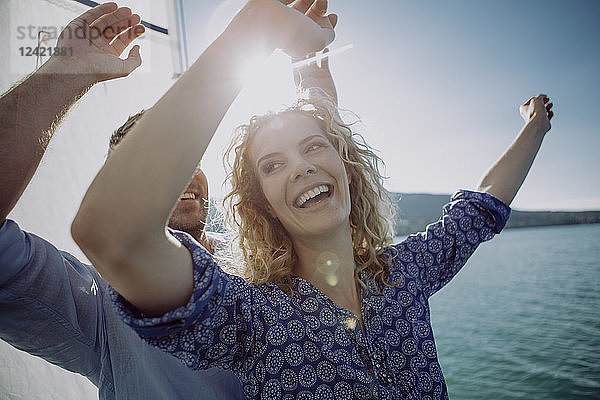 Happy couple on a sailing boat