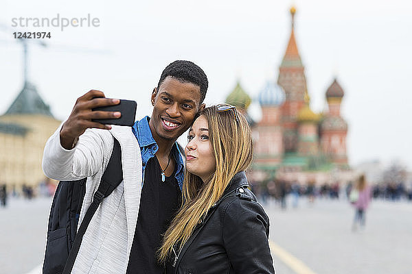 Russia  Moscow  couple taking a selfie and smiling