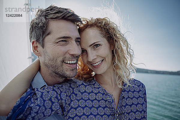 Happy couple on a sailing boat