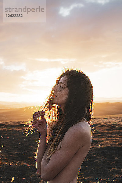 Iceland  naked young woman at sunset