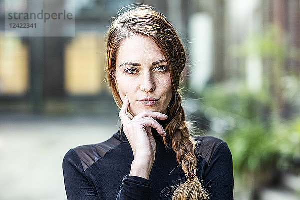 Portrait of serious woman with braid