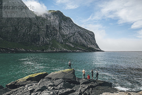 Norway  Lofoten  Moskenesoy  Young men fishing at Horseid Beach