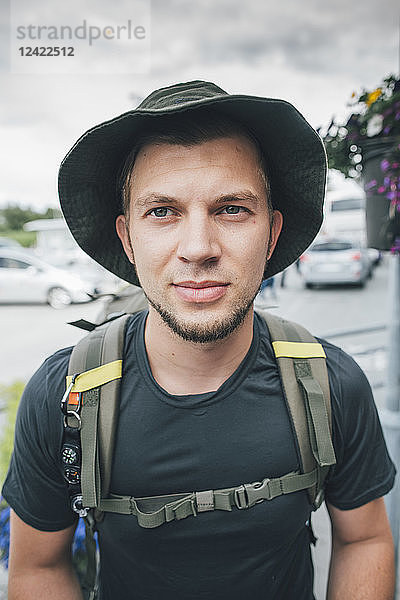 Portrait of backpacker with hat  travelling the Lofoten