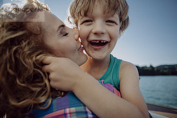 Mother and happy son at a lake