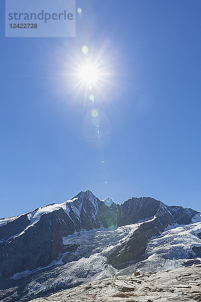 Austria  Carinthia  Grossglockner peak  galcier against the sun  High Tauern National Park