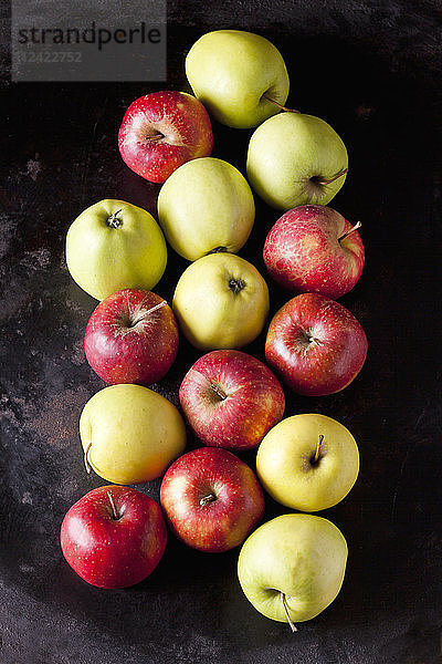 Various apples on dark ground