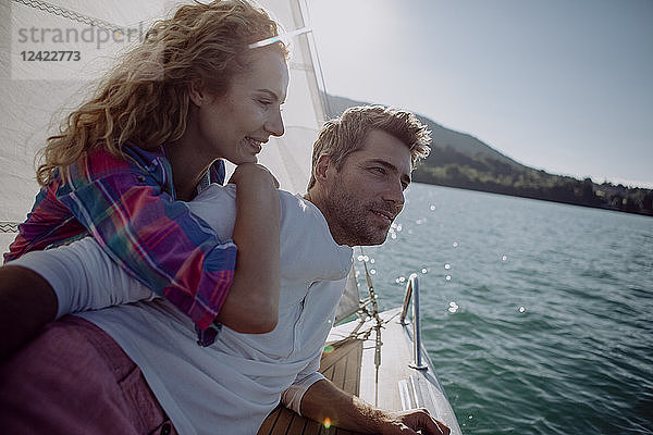 Happy couple on a sailing boat