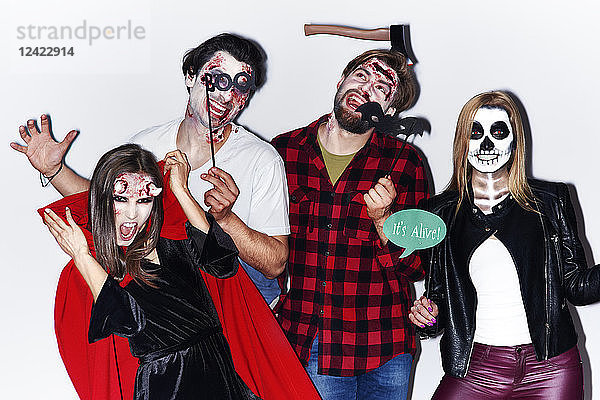 Friends in creepy Halloween costumes  portrait
