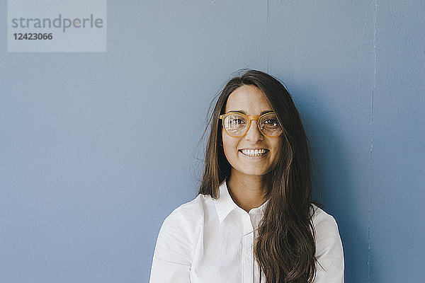 Portrait of a pretty  clever  young woman  wearing glasses