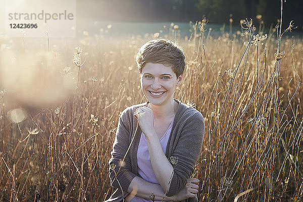 Portrait of smiling woman relaxing in nature