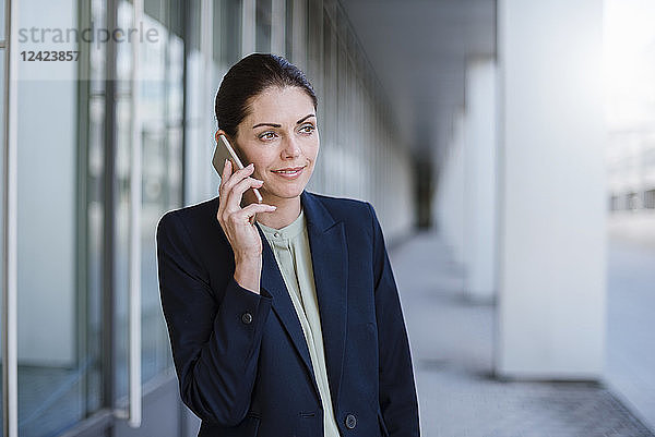 Portrait of smiling businesswaman on the phone