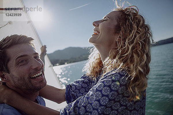 Happy couple on a sailing boat