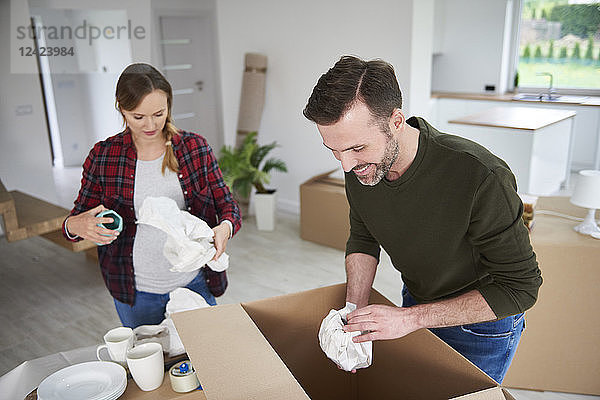 Couple moving house packing their belongings