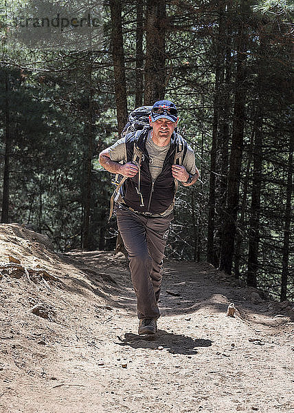 Nepal  Solo Khumbu  Everest  Sagamartha National Park  Mountaineer hiking wwith rucksack