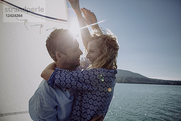 Happy couple on a sailing boat