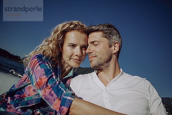 Affectionate couple on a sailing boat