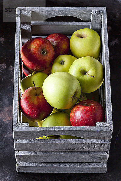 Grey wooden box of apples