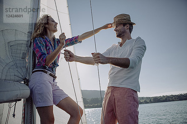 Happy couple on a sailing boat