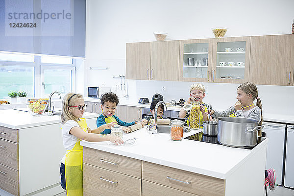 Pupils cooking together in cooking class