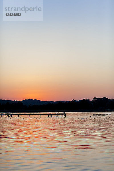 Germany  Bavaria  Chiemsee  boardwalk at sunset