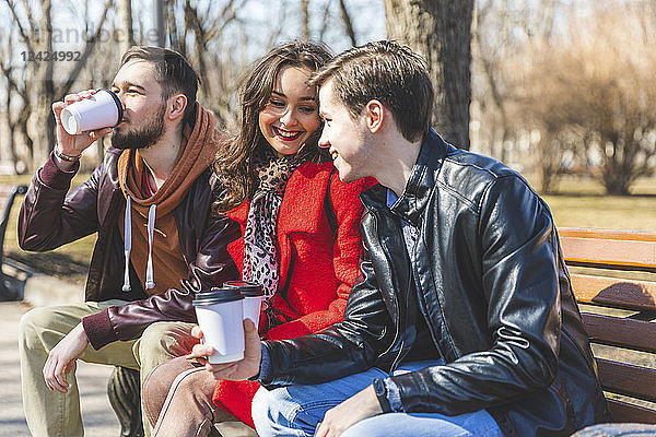 Russia  Moscow  group of friends at park having fun together  drinking coffee