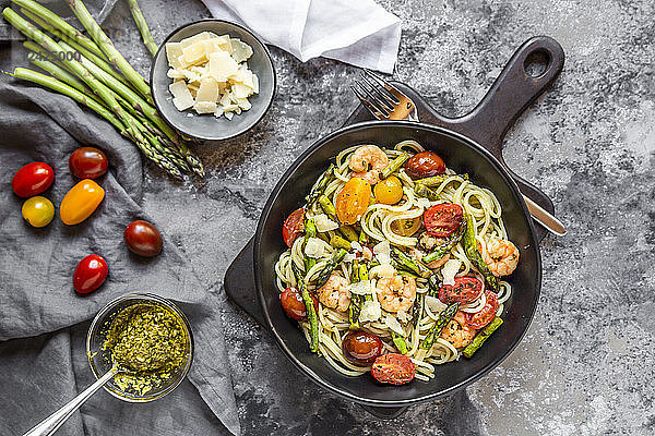 spaghetti with shrimps  green asparagus  tomato  pesto and parmesan