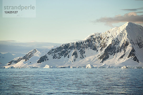 Antarctic  Antarctic Peninsula  snow covered mountains with ice and glacier in the morning