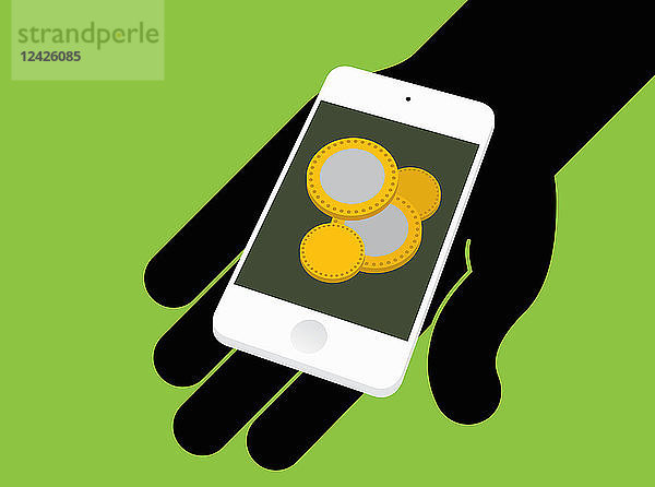 Hand hält Smartphone mit Münzen auf dem Bildschirm