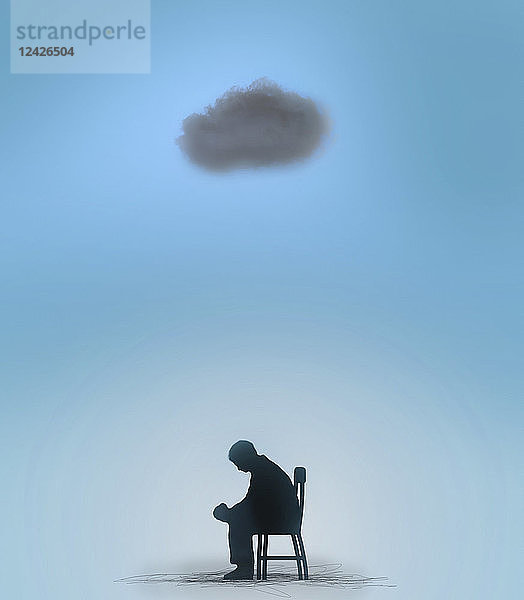 Mann sitzt unter einer schwarzen Wolke