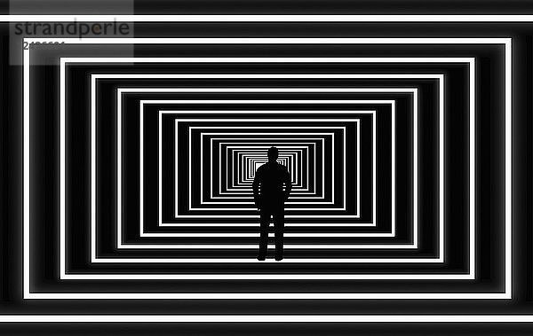 Silhouette eines Mannes  der das Licht am Ende des Tunnels sieht
