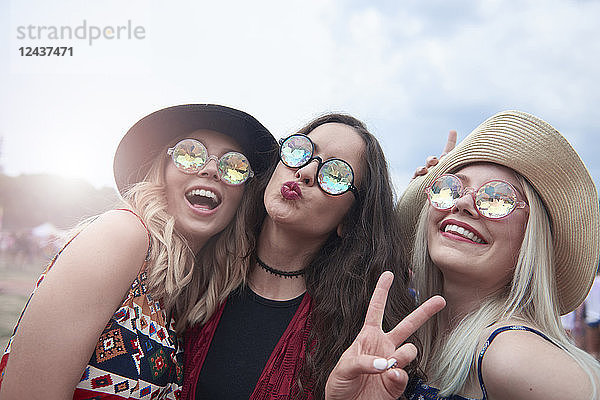 Portrait of three women having fun at the music festival