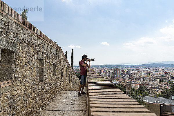 Spain  Girona  man at the castletaking picture of the city