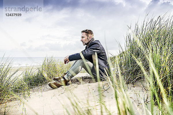 Man sitting in dunes