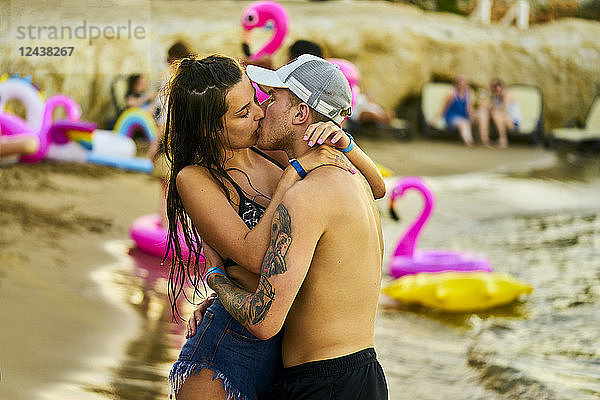 Greece  Crete  passionate lovers kissing at beach party