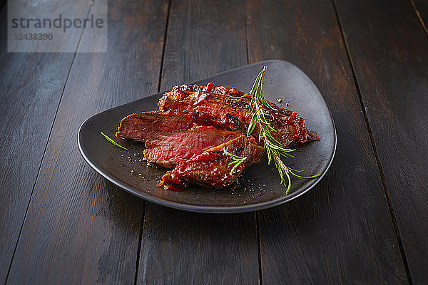 Beefsteak with rosemary on plate