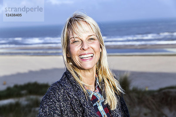 Portrait of happy woman at the sea
