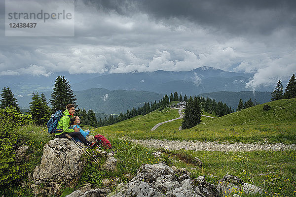 Germany  Lenggries  young hiker couple having a rest