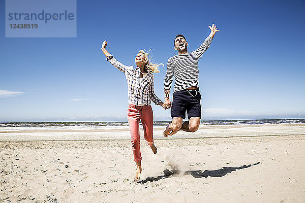 Happy carefree couple on the beach