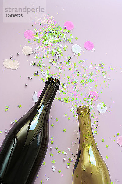 Stillife with champagne and wine bottle and confetti