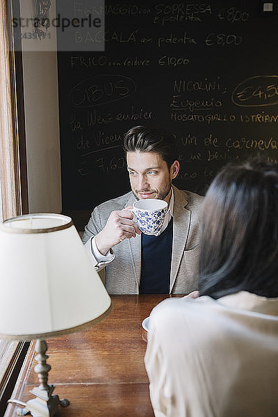 Elegant couple in a cafe