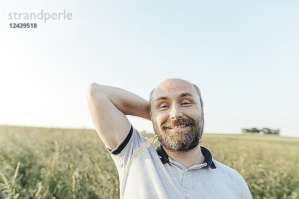 Portrait of mature man pulling funny faces in nature