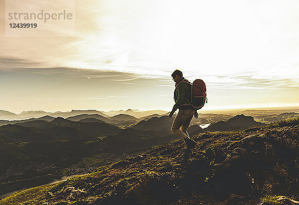 Austria  Salzkammergut  Hiker with backpack hiking in the Alps