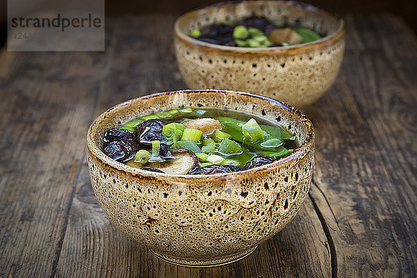 Japanese miso soup with sugar peas  shitake mushrooms  tofu and mung sprouts