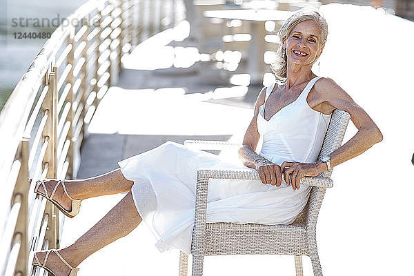 Senior woman relaxing on bench