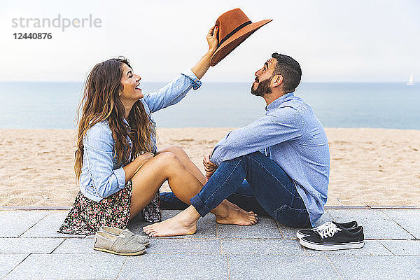 Spain  Barcelona  couple having fun together on the beach