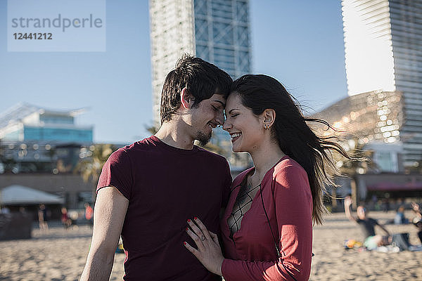 Happy affectionate young couple on the beach