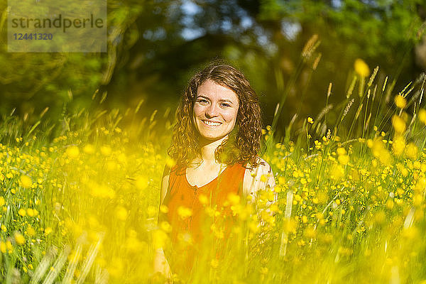 Young woman in summer meadow