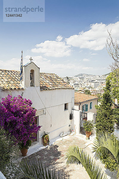 Greece  Attica  Athens  Plaka district  greek chapel and flowering bougainvillea